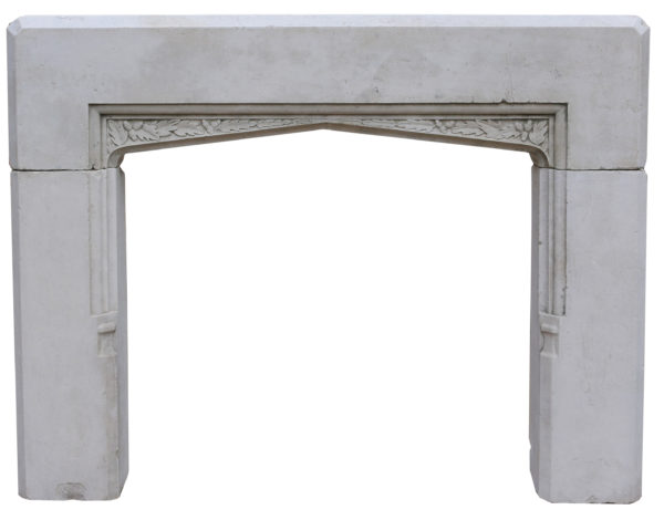 An Antique English Gothic Style Stone Fireplace