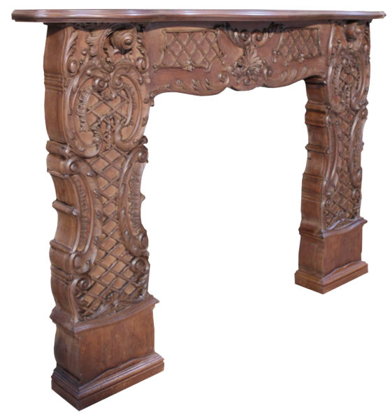 An Antique Rococo Style Carved Mahogany Fire Surround