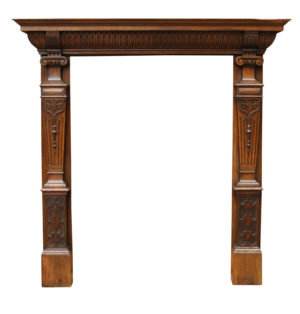 An Antique English Carved Oak Fire Surround