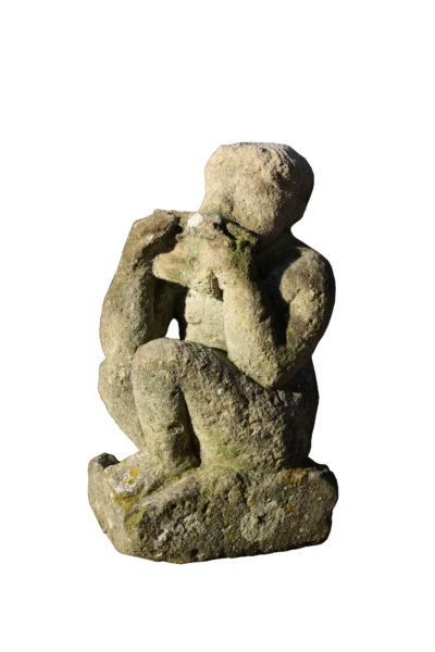 An Antique Carved Limestone Statue of A Boy Playing Pipes