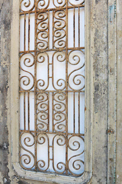 A Set of Antique Exterior Doors with Iron Grills
