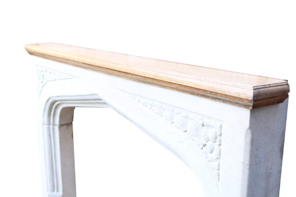 An Antique English Gothic Style Limestone Fire Surround