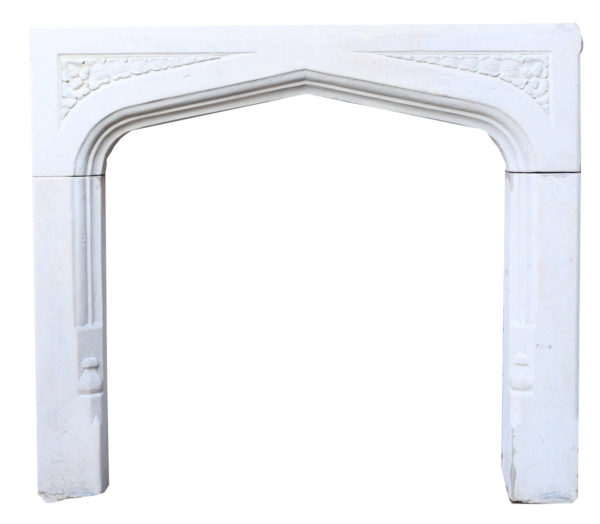 An Antique English Gothic Style Limestone Fire Surround