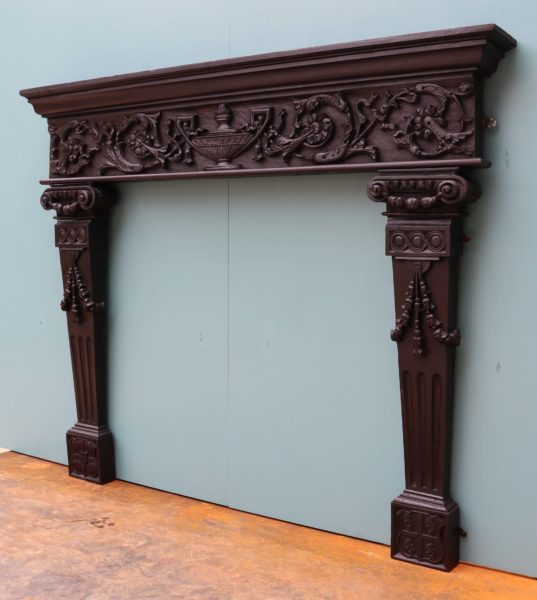 An English Carved Oak Tudor Style Fireplace