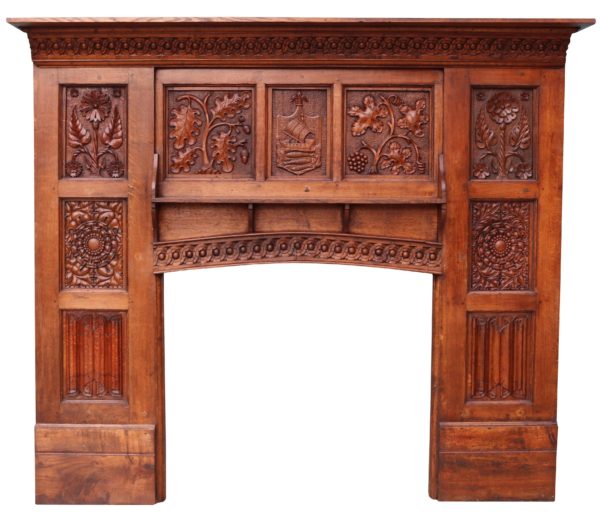 An English Arts & Crafts Style Carved Oak Fireplace