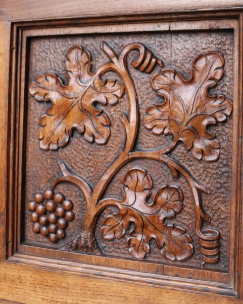 An English Arts & Crafts Style Carved Oak Fireplace