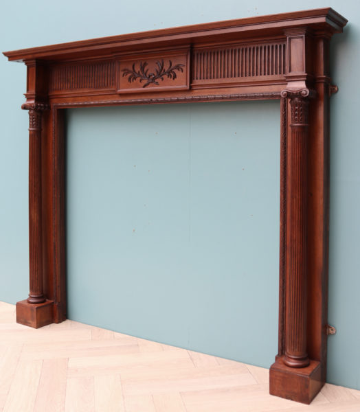 An Antique Carved Walnut Fireplace