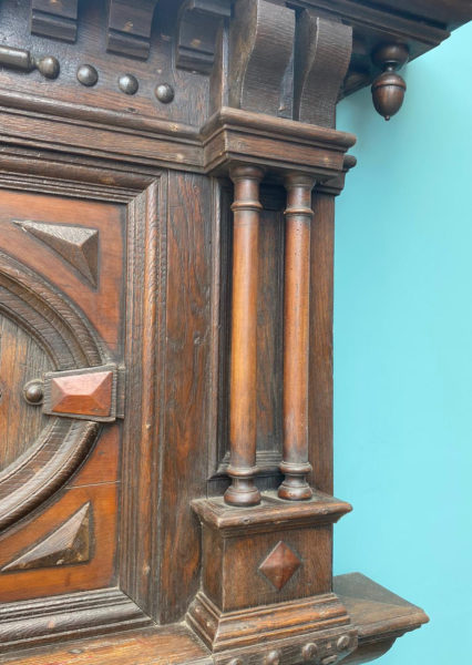 A Tall Jacobean Period Carved Oak Fireplace Surround