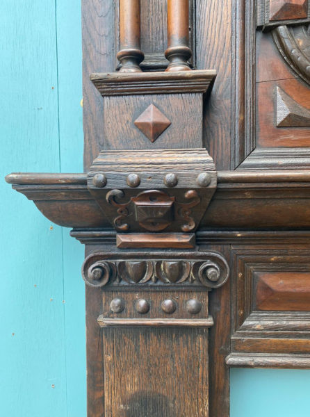 A Tall Jacobean Period Carved Oak Fireplace Surround