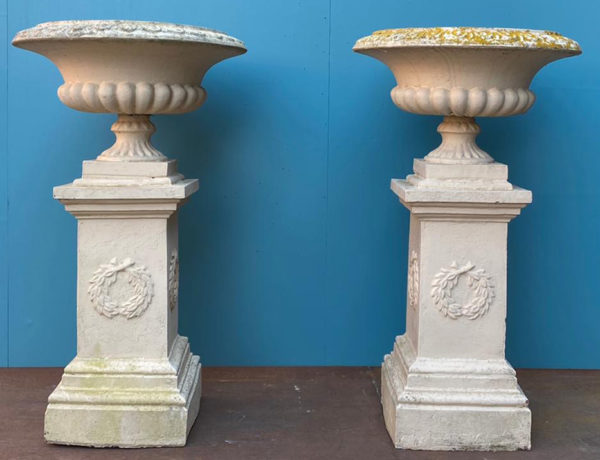 A Set of Four Large Terracotta Garden Urns with Pedestals