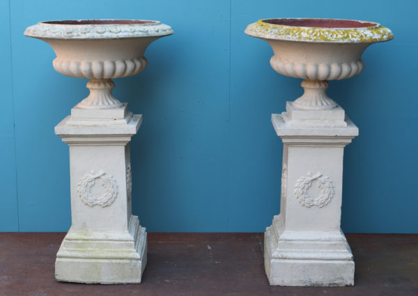 A Set of Four Large Terracotta Garden Urns with Pedestals