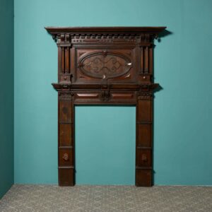 A Tall Jacobean Period Carved Oak Fireplace Surround