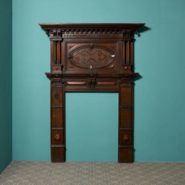 A Tall Jacobean Period Carved Oak Fireplace Surround