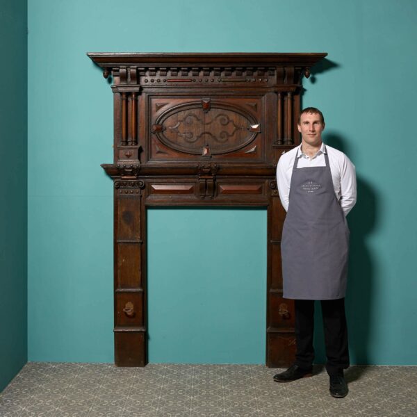 A Tall Jacobean Period Carved Oak Fireplace Surround