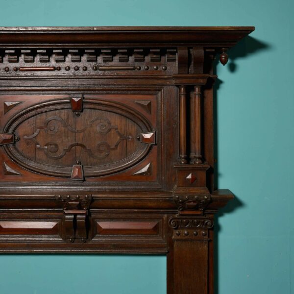 A Tall Jacobean Period Carved Oak Fireplace Surround