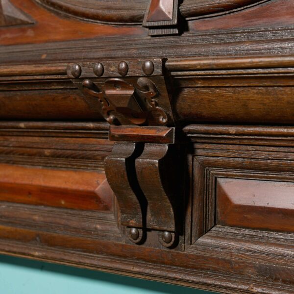 A Tall Jacobean Period Carved Oak Fireplace Surround