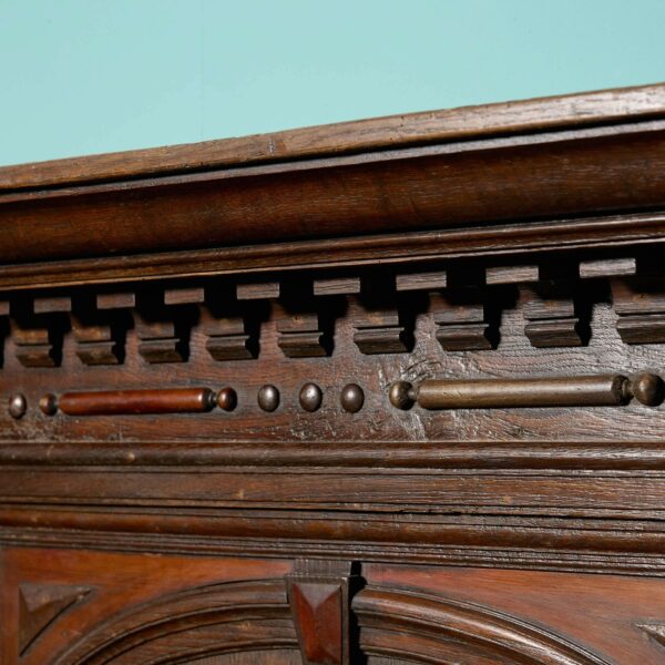 A Tall Jacobean Period Carved Oak Fireplace Surround