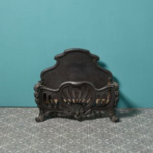 An Antique Rococo Style Iron and Brass Fire Grate