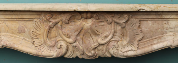 An Antique Louis XV Style Carved Sarrancolin Marble Fireplace