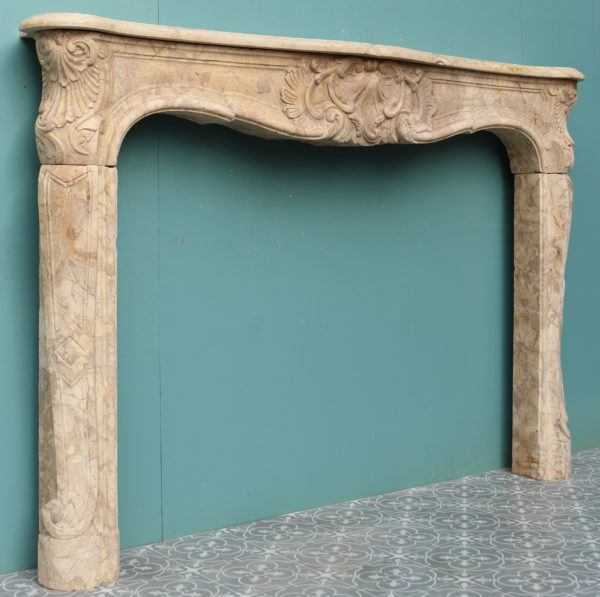 An Antique Louis XV Style Carved Sarrancolin Marble Fireplace