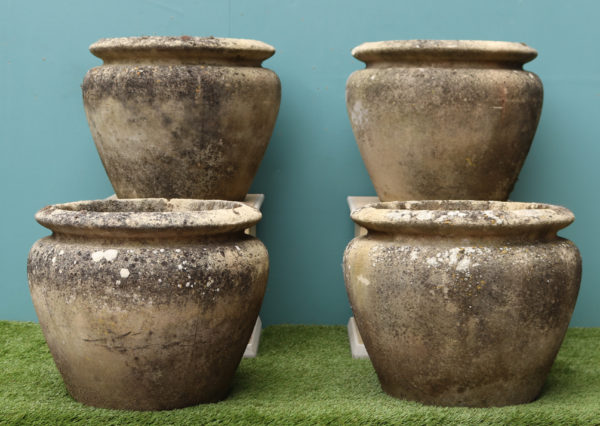 A Set of Four Reclaimed Weathered Stone Planters