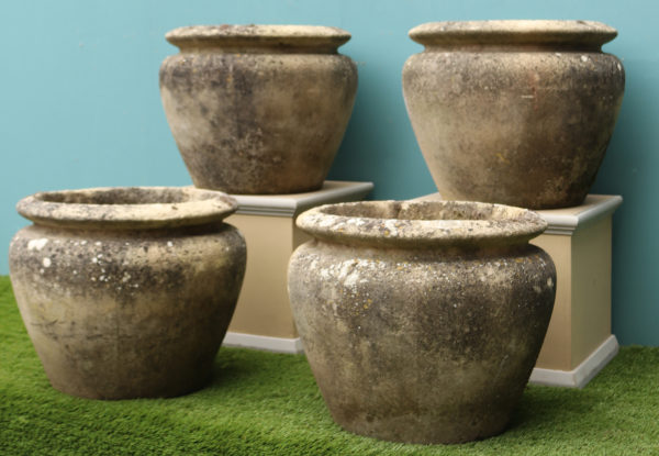 A Set of Four Reclaimed Weathered Stone Planters