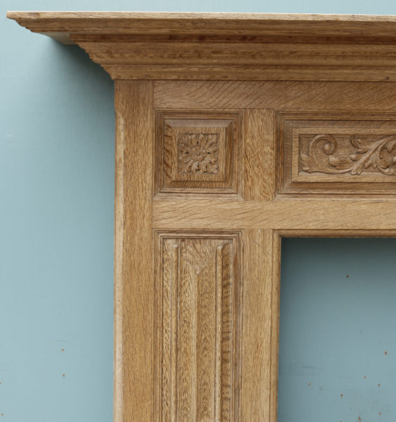 An Antique Carved Oak Fireplace Surround