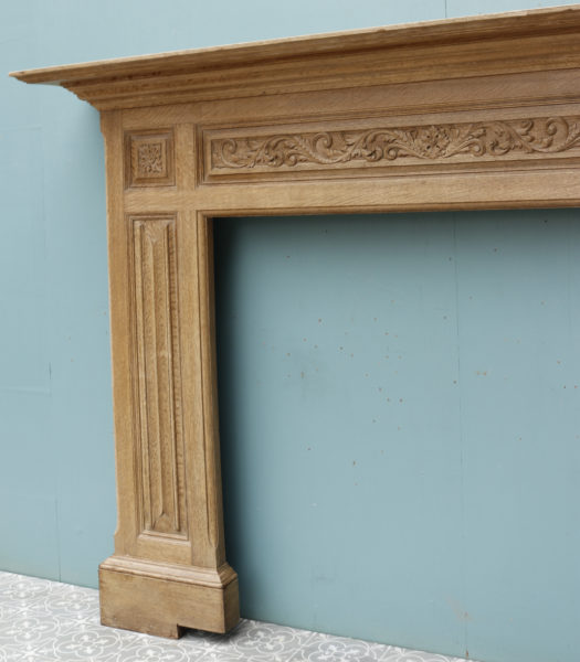 An Antique Carved Oak Fireplace Surround