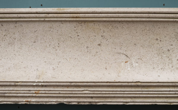 A 1920s Bolection Fireplace in Fossilised Limestone