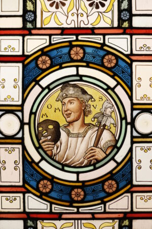 Antique Stained Glass Window Depicting Momus