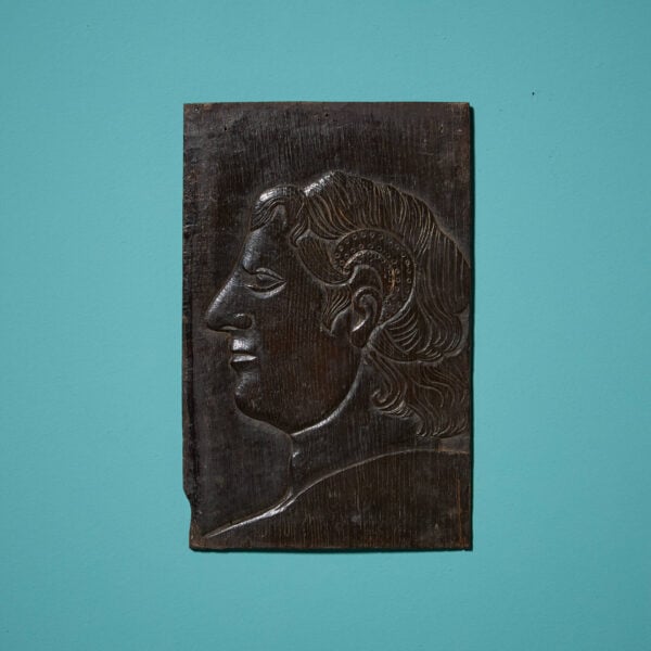A 17th Century Carved Oak Panel Of A Noble
