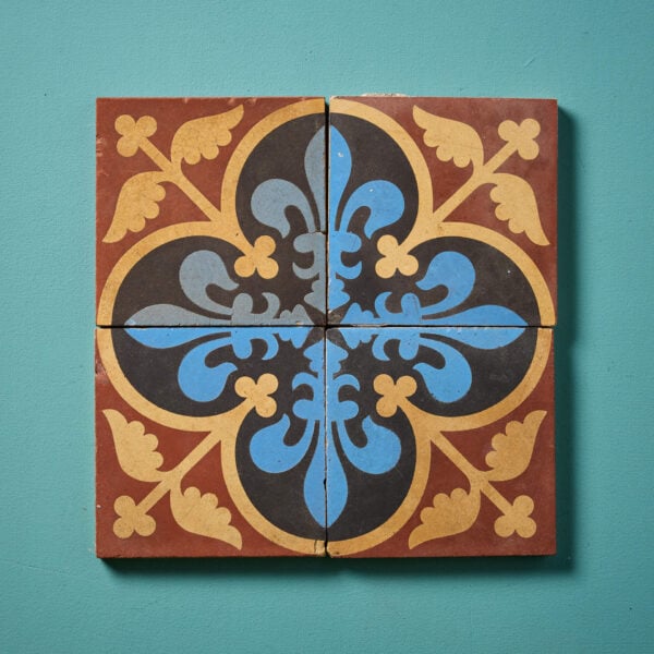 A Set Of Four Reclaimed Encaustic Floral Quatrefoil Tiles