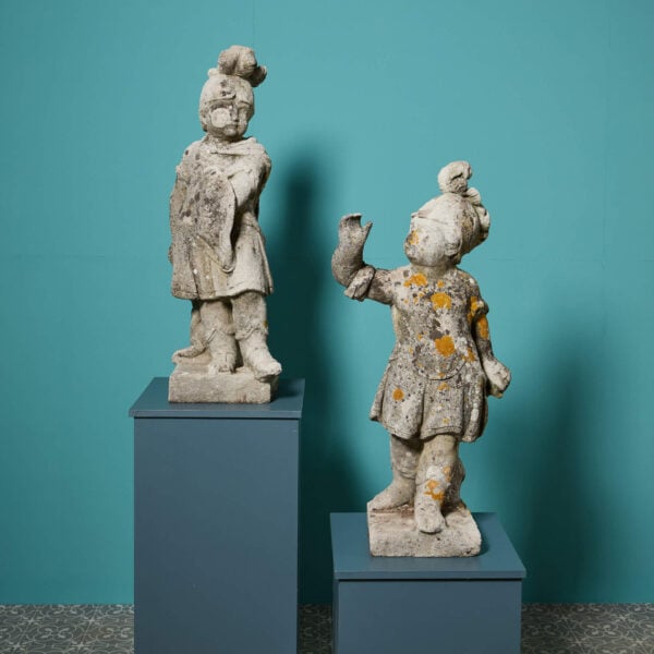 Pair of Weathered Stone Statues of Cherubs in Military Dress